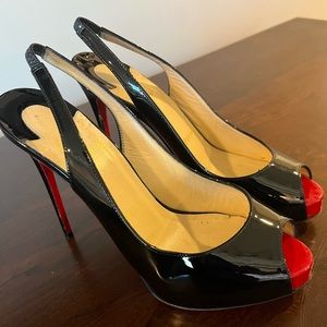 Authentic Christian Louboutin peep toe heels.